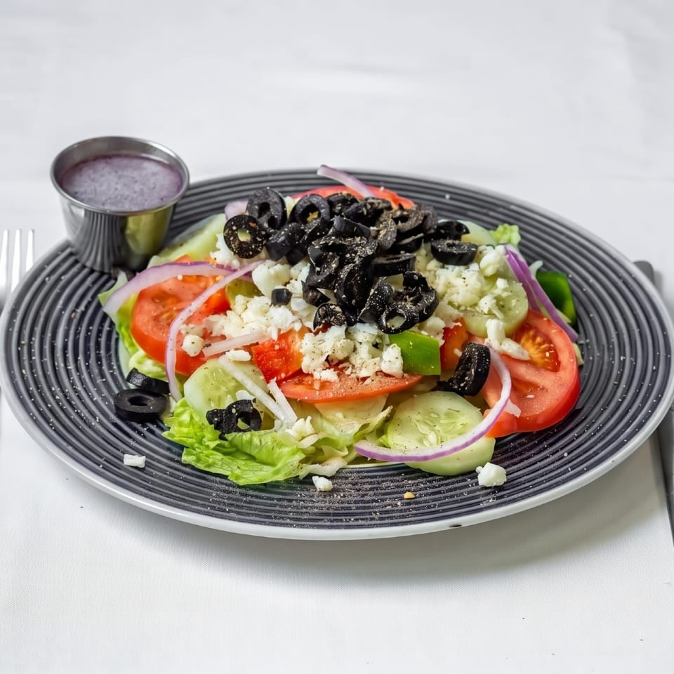 Salad with olives and crumbled cheese